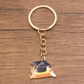 Graduation keychain featuring golden black mortarboard cap and colorful books pendant - Style 10 (21X26mm)