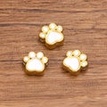 Set of three golden stainless steel dog paw beads with white enamel for DIY jewelry making - Double Sided Enamel Dog Paw Bead / White