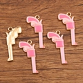 Pink enamel cowboy pistol charm for DIY jewelry making in golden finish - Pink Handgun