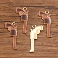 Set of four bronze revolver pendants with brown enamel finish for DIY jewelry making - Coffee Pistol Shape