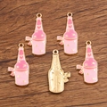 Pink enamel champagne bottle charms with hearts and stars for DIY jewelry making - Pink Wine Bottle
