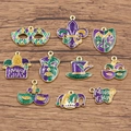 Detailed view of Mardi Gras enamel pendants with glitter on rustic wooden background - 10 Piece Mardi Gras Pendant Set