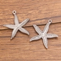 Polished silver starfish pendants in stainless steel with realistic textures and loops - 27x30mm / Style 1 Steel Color