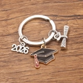 2026 graduation keychain featuring a black mortarboard charm and silver diploma tag - Style 9 (20X22mm)