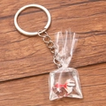 Creative resin goldfish water bag keychain with metal ring on wooden background - Red White Fancy Fish #11