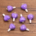 DIY purple heart charms with gold loops for jewelry making on wood background - Purple Heart