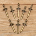 Eight pieces of antique bronze sword charms in medieval style for DIY jewelry making - Approximately 1g Of Ancient Green