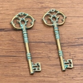 Set of two vintage hollow key pendants in antique bronze finish for jewelry making - 7 Key 31X83mm 10g
