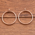 Two rose gold round bezel pendant frames for DIY jewelry making on wooden background - Inlaid Round Style / Rose Gold