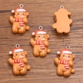 Five resin Christmas bear charms with Santa hats and striped scarves for DIY crafts - Size 3