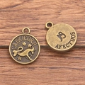 Bronze Capricorn zodiac charm pendant with embossed star patterns for DIY jewelry - Antique Bronze - Capricorn