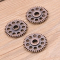 Three bronze gear pendants for DIY jewelry with steampunk industrial design elements - Red Bronze 3.6g