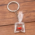 Miniature goldfish in water bag keychain pendant on wood surface for accessories - Ornamental Fish Style 2