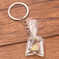 DIY clear resin keychain with a yellow and white striped tropical fish in a water bag - Striped Butterfly Fish #5