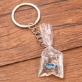 Miniature goldfish bag keychain with silver ring on wood background - Picasso Triggerfish Liquid Bag #3
