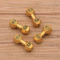 Golden dumbbell-shaped DIY jewelry beads engraved with LIVE and LIFT on wooden surface - Small / Antique Gold