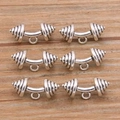Flat lay of antique silver dumbbell charms for DIY jewelry on wooden surface - Dumbbell Style (20E03) / Antique Silver