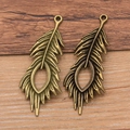 Vintage bronze and copper alloy peacock feather charms for DIY jewelry making - Bronze
