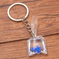 DIY creative keychain with blue fish in a transparent resin bag charm and silver chain - Blue Goldfish