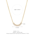 Gold stainless steel necklace featuring a curved row of seven clear cubic zirconia stones - Square Row Zirconia Necklace / Gold