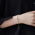 Elegant 18K gold-plated stainless steel chain bracelet on wrist with adjustable clasp - Gold Bracelet