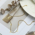 Golden titanium steel necklace featuring five diamond-shaped charms on an O-link chain - Cube