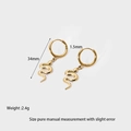 Detail view of 14k gold plated snake drop earrings with scale texture and 34mm dimensions - Snake Scale Texture (DFE202317)