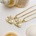 Detailed macro view of sea fish pendant featuring blue zircon eye and cubic zirconia stones - Gold Fish Necklace (25110216)