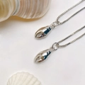 Detail of silver crab claw pendant with micro-pave zircon on a box chain for ocean themes - Silver Crab Claw Necklace (25110216)