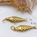Detailed macro view of 25mm gold fish pendant with zircon eye and hollow diamond pattern - Gold Lattice Fish Pendant Only (Without Chain) (25110216)
