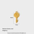 Detail of a 1g gold-plated stainless steel key charm with sun and star engravings - Key Shape (DFC182)
