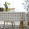 Classic beige checkered tablecloth on a wooden table in a cozy Nordic style dining room - 60x60 / Rice White Plaid