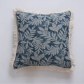 Square throw pillow cover with navy blue jacquard leaf patterns and cream tassels - Jacquard Blue Water Grass White Fringe