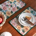 Vintage floral jacquard placemat with green scalloped edges on a wooden table - Jacquard Multicolor Floral Embroidery with Green Scalloped Edge