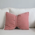 Bow-shaped pillow with red and white stripes and white pom-pom lace on a sofa - Fine Red Striped / 43x55cm