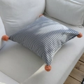 Blue striped cotton linen lumbar pillow with pink pom-poms on a white sofa - 45x45cm / Navy Thin Striped with Blue Pom-poms