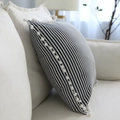 Blue and white striped linen waist pillow with decorative white pom-pom edges on a sofa - 45x45cm / Navy Thin Striped with White Pom-poms
