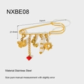 Macro view of a 70mm 18K gold plated stainless steel pin with sun and mermaid charms - Butterfly Mermaid Sun Style (NXBE08)