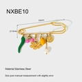 Detail view of 18K gold plated stainless steel brooch pin with assorted charm pendants - Chili Cherry Coin Pearl Style (NXBE10)