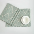 Set of navy blue woven placemats with geometric chevron jacquard pattern on a white table - Green / 32x45cm