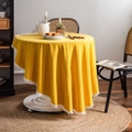Solid yellow round washed cotton tablecloth with white decorative pom-pom fringe edges - Yellow