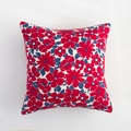 Detail of floral throw pillow cover with vintage red and blue blossoms on cream fabric - Red Floral