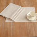 Linen placemat set with daisy floral print on a rustic wooden table with coffee cup - Foam Daisy