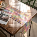 Colorful woven table runner with diamond patterns and white tassels on a rustic wood table - Multicolor Chenille Runner / 30-50 (including Tassels)