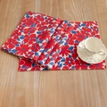 Blue and red floral cotton linen placemat set on a rustic wooden table for dining - Red Floral