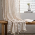 Beige crochet hollow window curtain with tassel edge in a cozy boho living room setting - Patchwork Crochet Rod Pocket / 150*160