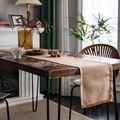 Natural jute table runner with fringe edges on rustic wood table for dining decor - Jute With Gold Thread