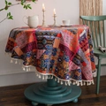 Bohemian striped round tablecloth with colorful patterns and tassels on a vintage table - Round 150cm / Exotic Patchwork Multicolor