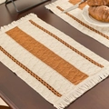 Woven placemat set with orange and white stripes, boho fringe edges, on dark wood table - Earth Yellow Three-Stripe White Fringe Placemat