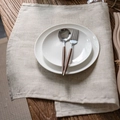Flat lay of stainless steel cutlery with wood handles and white ceramic dinner plates - 40*60cm / Polyester Linen